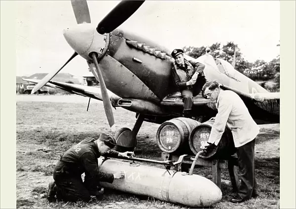A modified auxiliary fuel tank being filled with beer, Bognor Regis, 1944