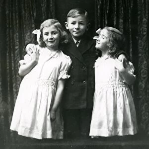 Studio portrait of three children, December 1935