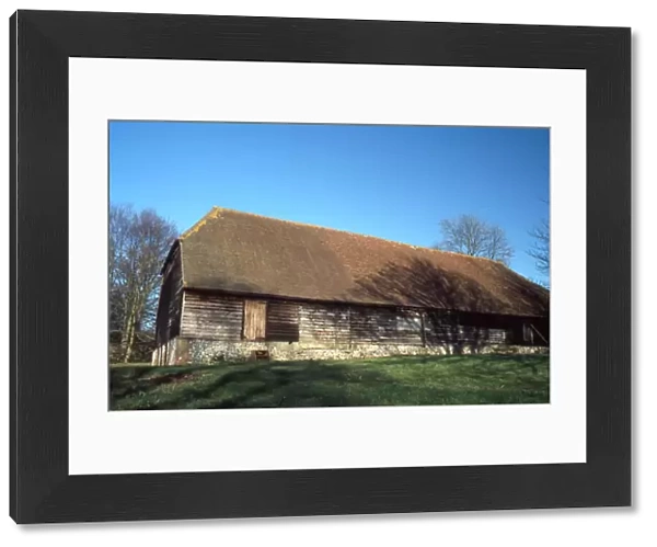 Wooden and flint barn at Watergate House Farm, West Marden, West Sussex
