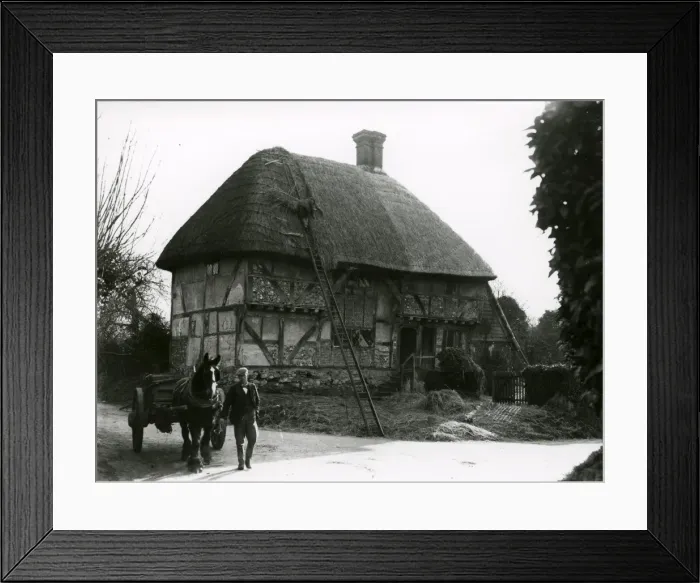 Framed Print : Bignor General Shop with thatcher at work, February 1938 Framed Print : Bignor General Shop with thatcher at work, February 1938