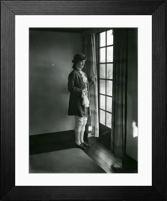 Framed Print : Lady in fancy dress gazing out of a window, February 1938 Framed Print : Lady in fancy dress gazing out of a window, February 1938