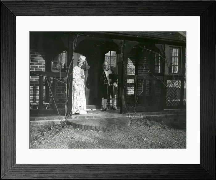 Framed Print : Lady and Gentleman in costume standing on a balcony, February 1938 Framed Print : Lady and Gentleman in costume standing on a balcony, February 1938