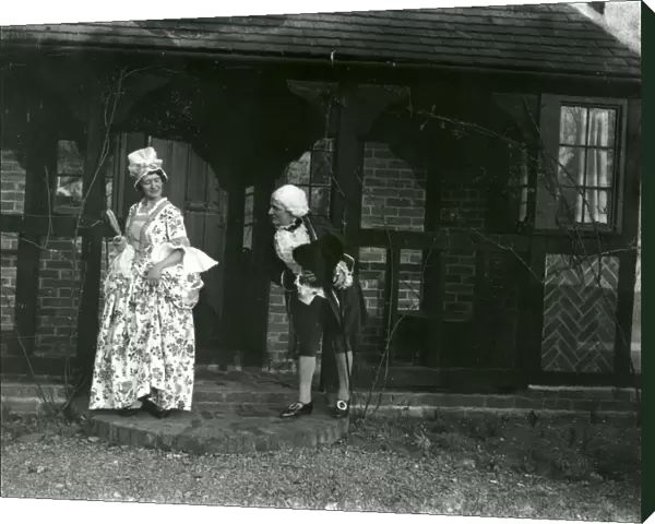 Lady and gentleman posing in fancy dress, February 1938