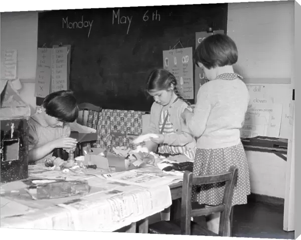 Three girls in a classroom at Lancastrian Infants School, Chichester, May 1956