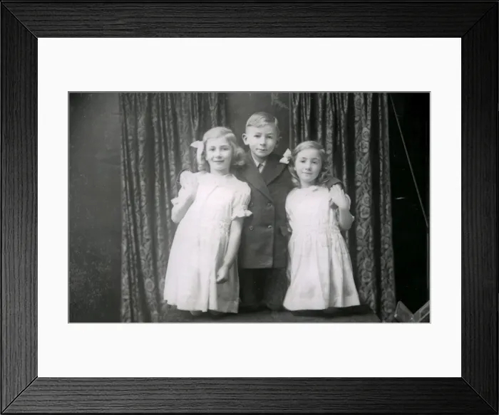 Framed Print : Studio portrait of two girls and a boy, December 1935 Framed Print : Studio portrait of two girls and a boy, December 1935
