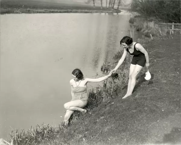 Two young ladies attempting to swim in river at Stopham, March 1938