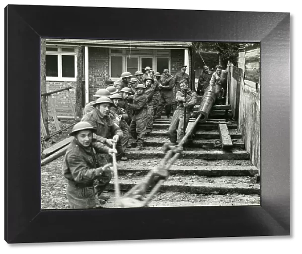 Men of The Royal Artillery moving barrel of gun, Bognor Regis 1940