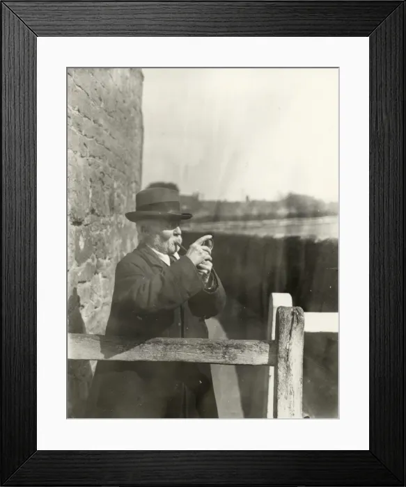 Framed Print : Gentleman lighting his pipe with a magnifying glass, March 1933 Framed Print : Gentleman lighting his pipe with a magnifying glass, March 1933