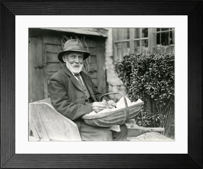 Framed Print : Man sitting outside house Framed Print : Man sitting outside house