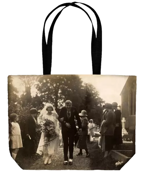 Wedding Couple being showered with confetti, 1925