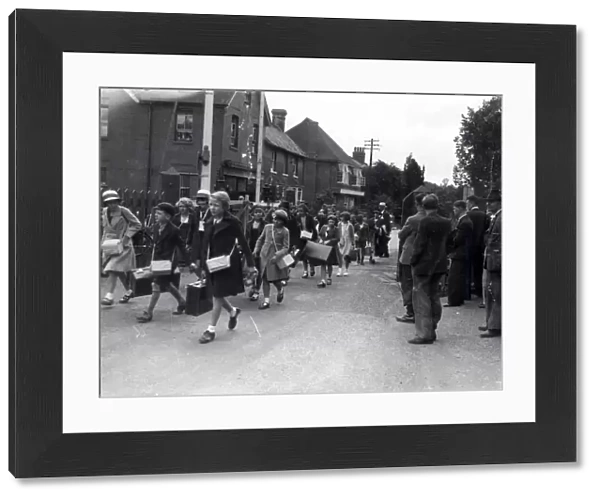 Evacuees walking through town, September 1939