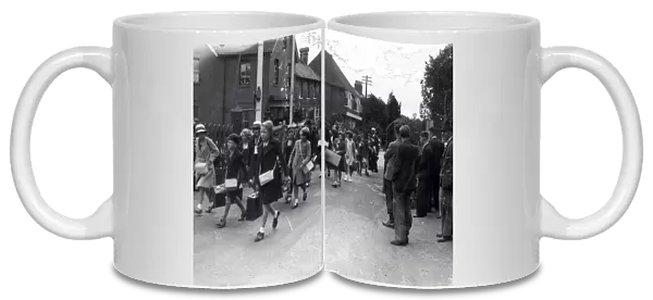 Evacuees walking through town, September 1939