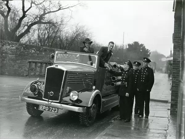 Wedding couple getting out of fire brigade vehicle, January 1945