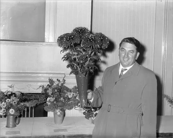 Man with chrysanthemums at show, 2 November 1961