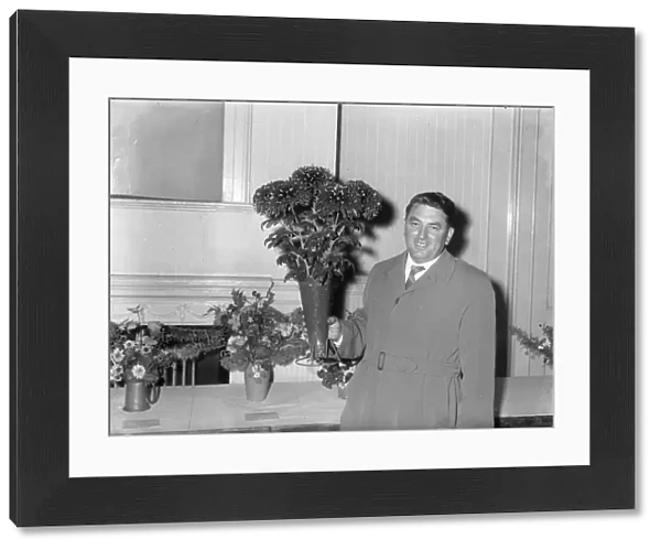 Man with chrysanthemums at show, 2 November 1961