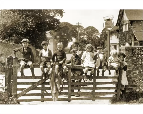 Children sit on a gate, Salvington Road, Durrington, Worthing