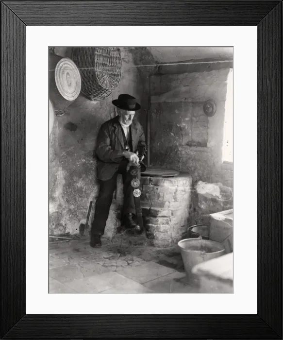 Framed Print : Elderly gentleman polishing horse brasses, September 1935 Framed Print : Elderly gentleman polishing horse brasses, September 1935