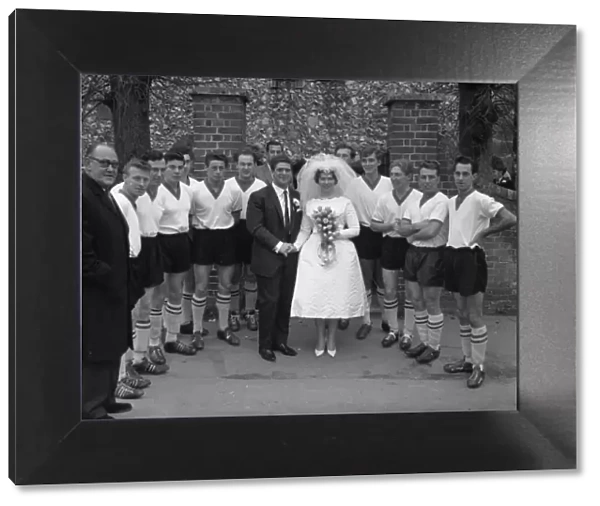 Wedding group with football players, November 1962