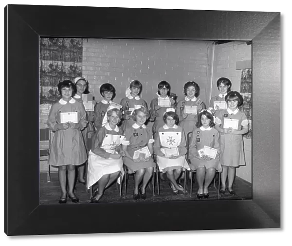Group of St Johns Ambulance nurses holding up certificates
