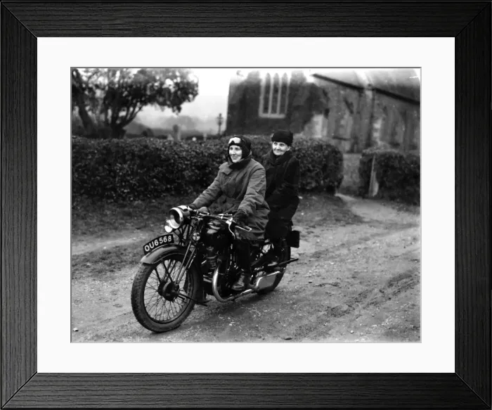 Framed Print : Two ladies riding a motorbike Framed Print : Two ladies riding a motorbike