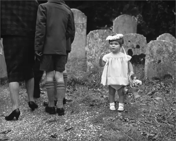 Little bridesmaid in churchyard