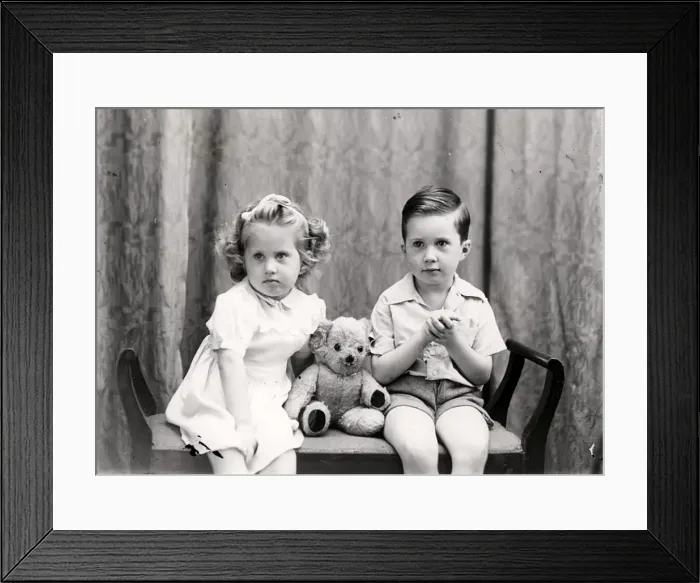 Framed Print : Girl and boy posing with a teddy bear Framed Print : Girl and boy posing with a teddy bear