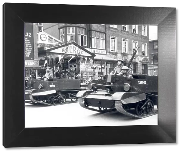 Bren Gun Carriers parading past The Arcade, Bognor, 1941