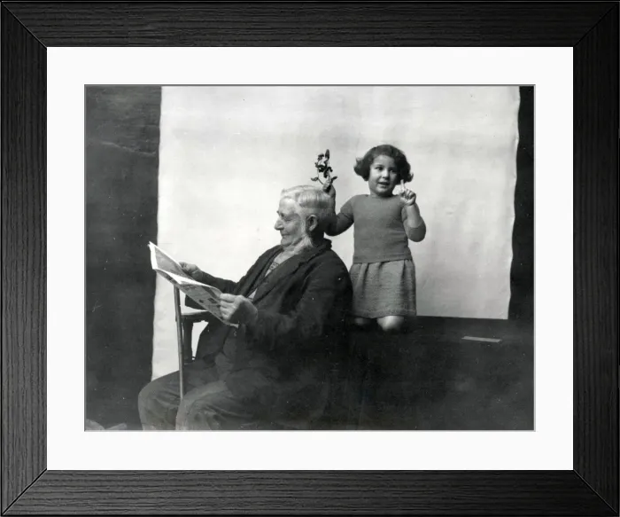 Framed Print : Gentleman and young girl with mistletoe Framed Print : Gentleman and young girl with mistletoe