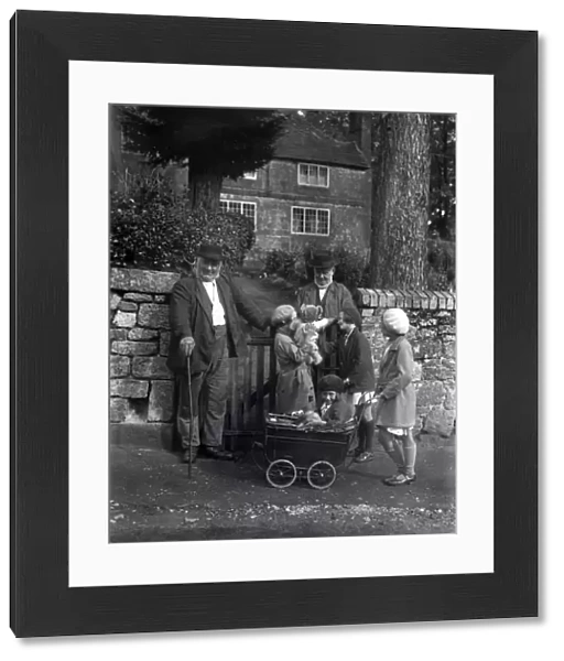 Two elderly gentlemen and four young girls chatting in Upperton, Sussex, 1935
