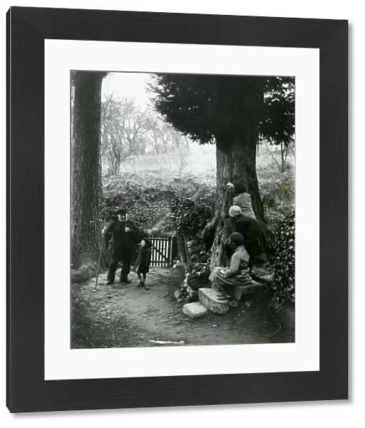 Children and country gentleman walking in the countryside, December 1935