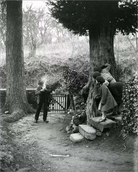 Country man lighting his pipe at Upperton, December 1935