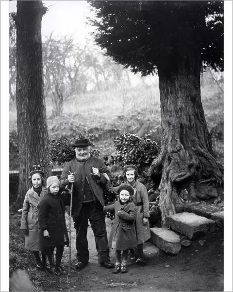 Gentleman and children gathering holly at Upperton, Sussex