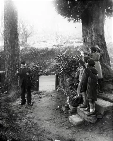 Four girls waving to elderly gentleman at Upperton, Sussex. December 1935