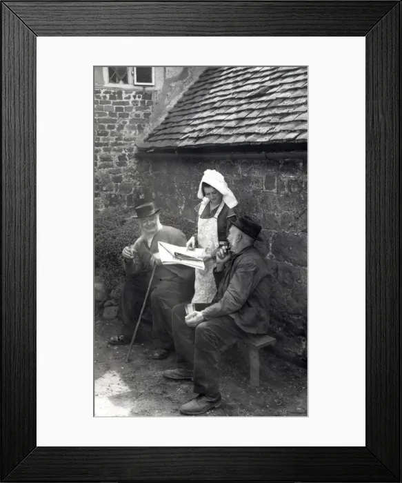 Framed Print : Two elderly gentlemen discussing the news in a paper Framed Print : Two elderly gentlemen discussing the news in a paper