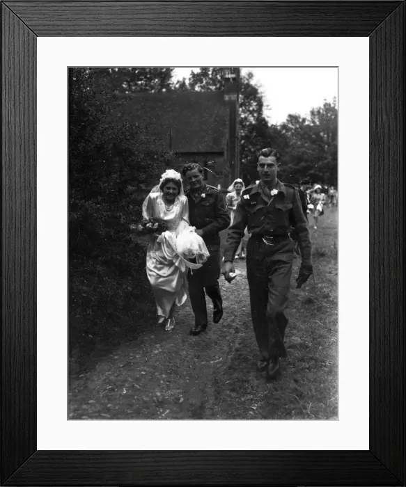 Framed Print : Bridal party walking down church path, Groom in army uniform, 1940s Framed Print : Bridal party walking down church path, Groom in army uniform, 1940s