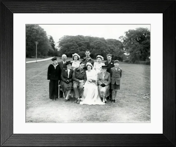 Framed Print : Wedding party posing in church grounds at Ebernoe, Sussex, 1940s Framed Print : Wedding party posing in church grounds at Ebernoe, Sussex, 1940s