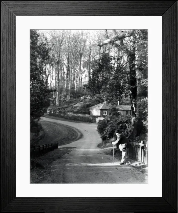 Framed Print : Gentleman leaning on stick in country lane, January 1935 Framed Print : Gentleman leaning on stick in country lane, January 1935