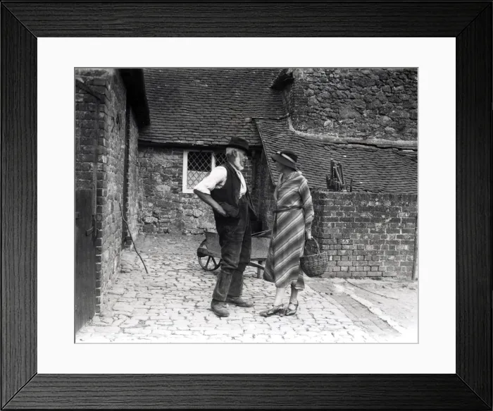Framed Print : Lady and farm worker talking in farmyard, September 1933 Framed Print : Lady and farm worker talking in farmyard, September 1933
