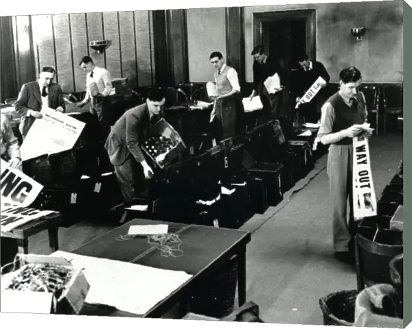 Filling ballot boxes in Council Chamber in first post-war election