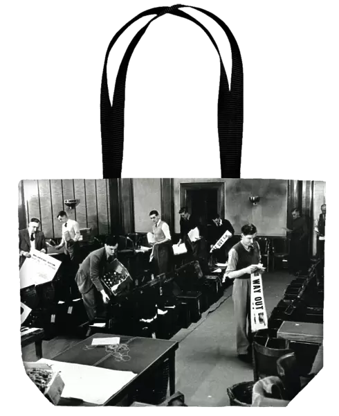 Filling ballot boxes in Council Chamber in first post-war election