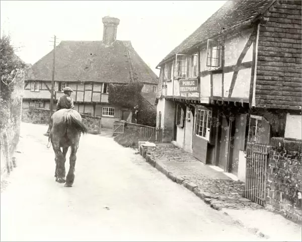 Young boy riding shire horse at Byworth, Sussex, c1931