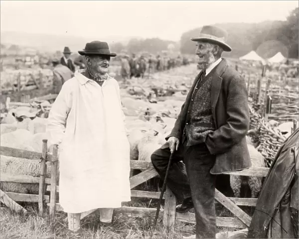 Two shepherds sitting on a fence at Findon Sheep Fair, 1931