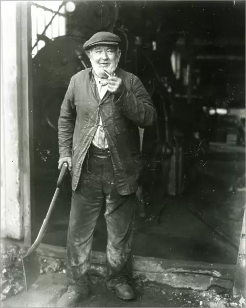 Stoker at a saw mill, West Grinstead, October 1933