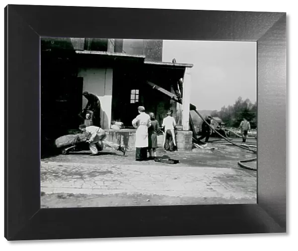 Rescuing items from a fire at Coultershaw Mill, Petworth, 16 May 1946