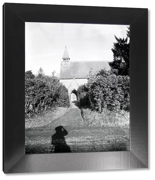 Shadow of a man looking at Southwater Church, 1 December 1951