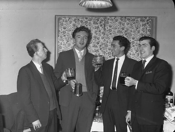 21st Birthday Party. Four men share a drink at a 21st birthday party, 22nd Feb 1962.