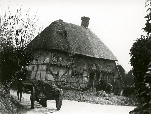 Bignor General Shop with thatcher and horse and cart, February 1938