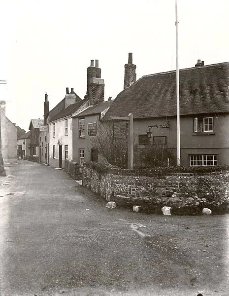 Bosham, 1931. View of harbour and village street including the Anchor Bleu