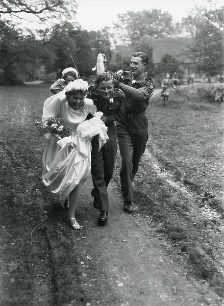 Bride and Groom being showered by confetti, 1940s