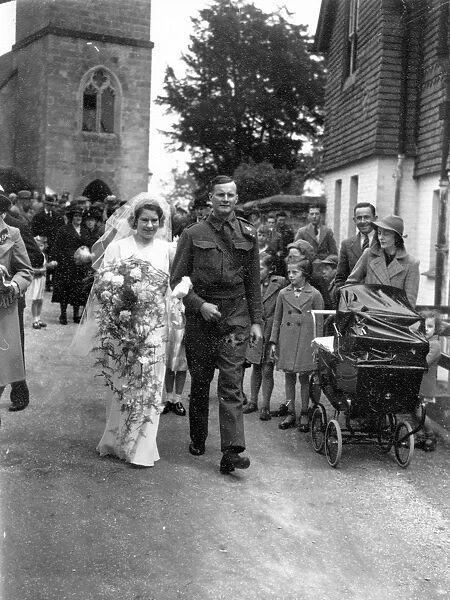 Bride and Groom walking down church path, June 1941
